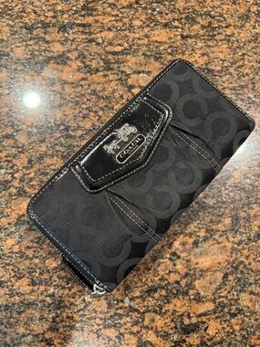 COACH Black Zip-Around Wallet w/ accordion interior. Appx 8” x 4”